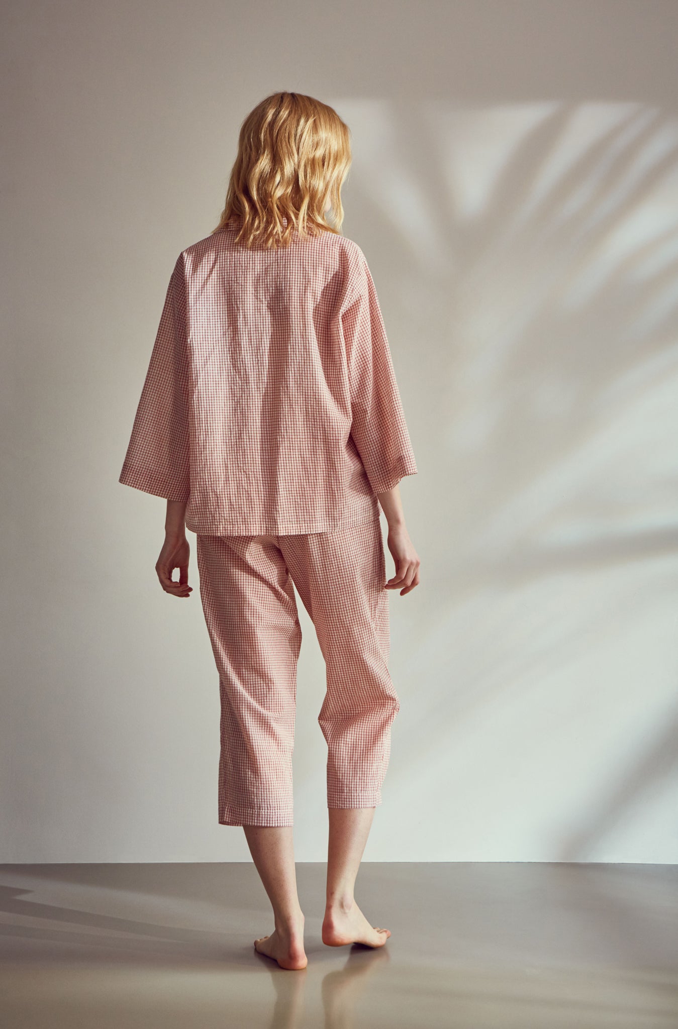 Hand woven khadi cotton, Indian red check pyjamas. Hand made from sustainably grown non GM cotton. Light weight and skin friendly these pure cotton pyjamas are luxuriously soft to sleep in. Our one size fits a UK size 8-12