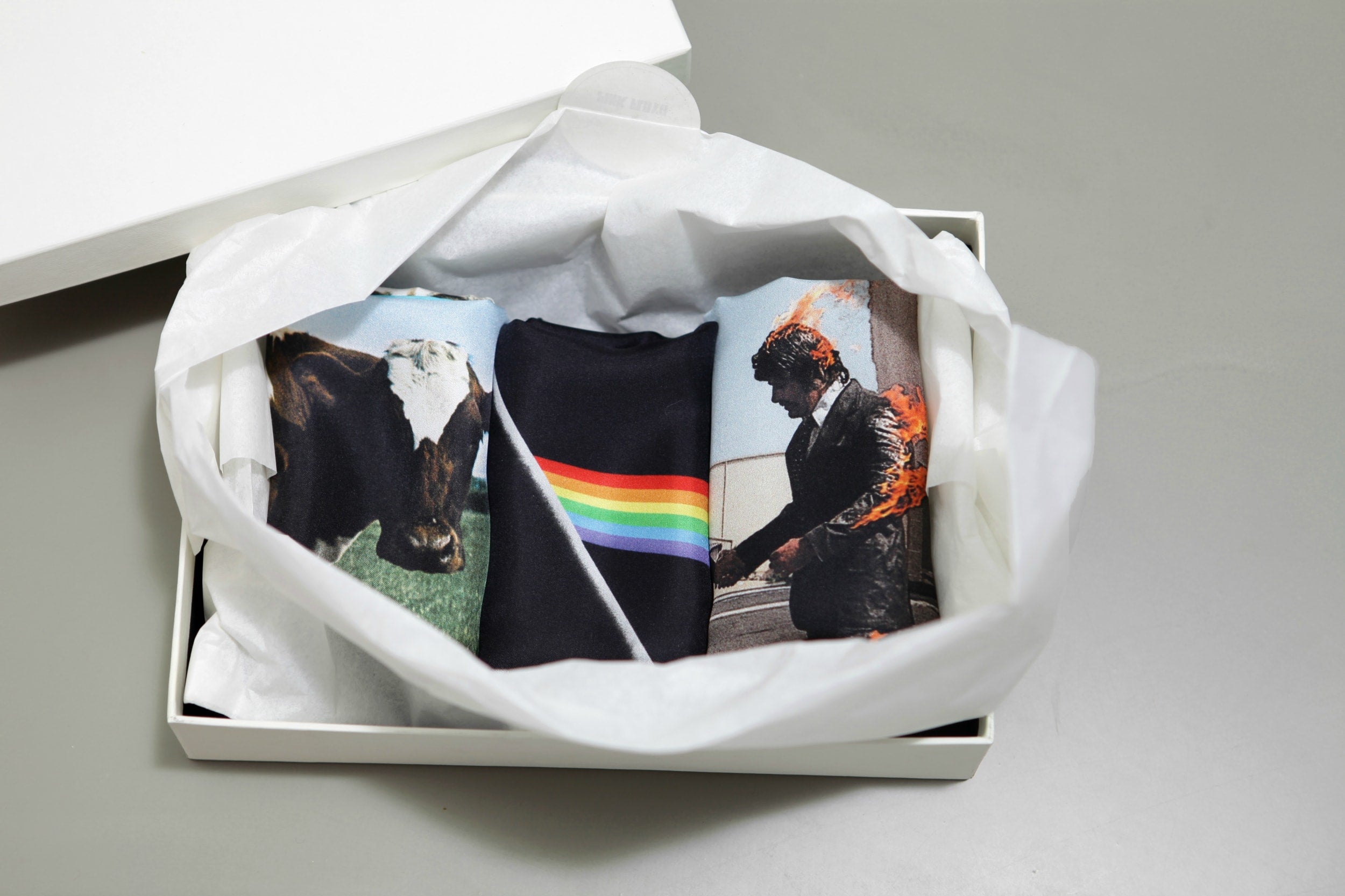 Limited edition set of three iconic Pink Floyd album covers, printed by sustainable, luxury, fashion brand Robe de Voyage, for Pink Floyd's Mortal Remains exhibition. 